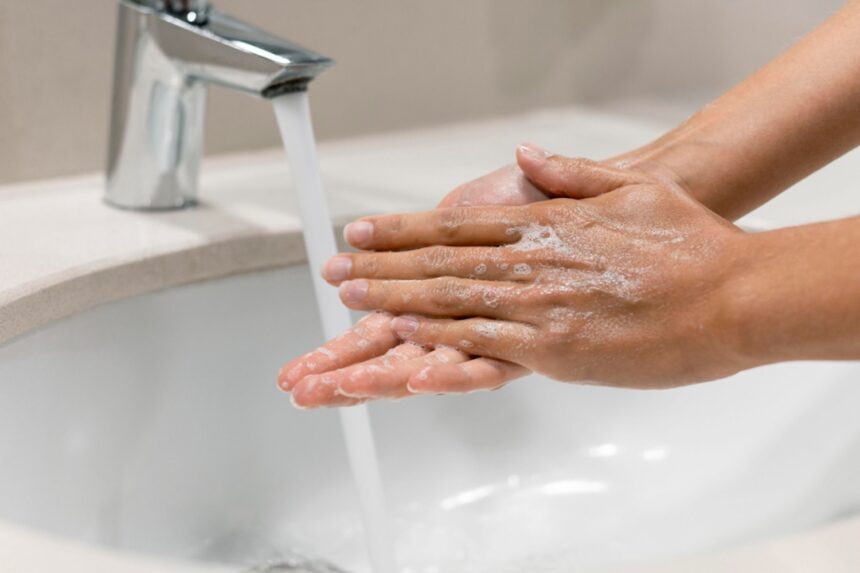 person washing hands close up